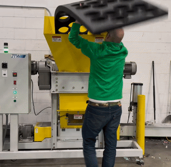 animated gif of foam being loaded into a shredder